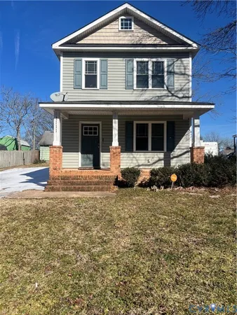 a front view of a house with garage