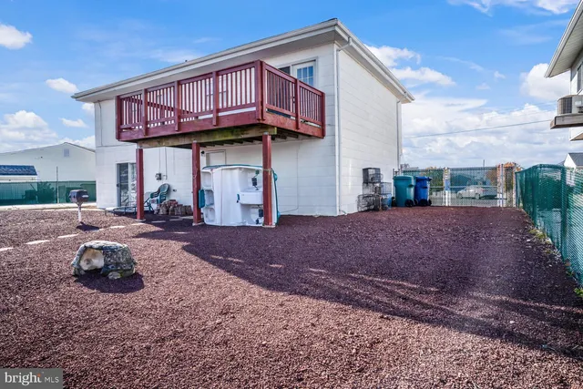 an aerial view of a house with a ocean view