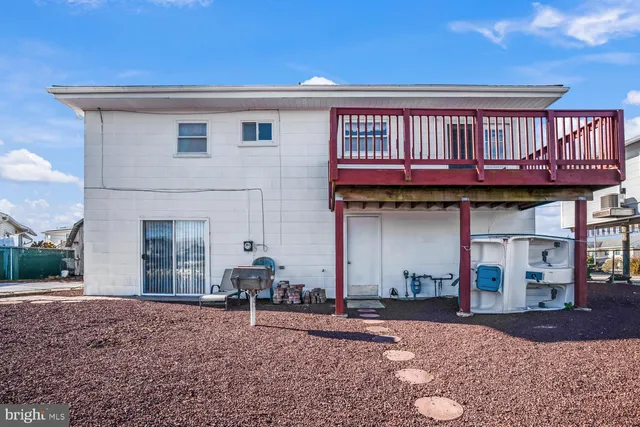 an aerial view of a residential houses with outdoor space