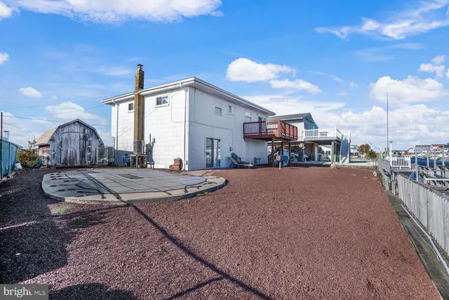 an aerial view of a house with a lake view