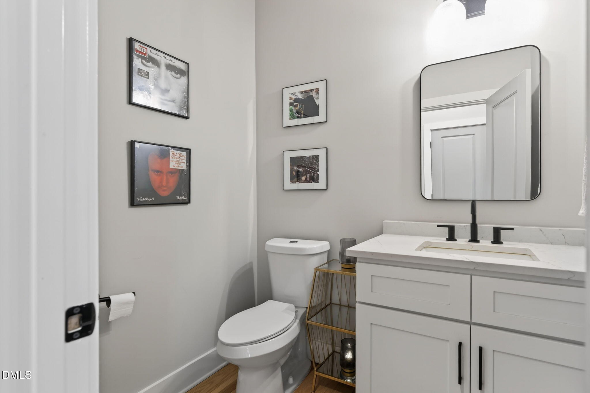 213 Lincoln Court Raleigh, NC 27610 - Photo 15 of 40 a bathroom with a toilet sink and mirror