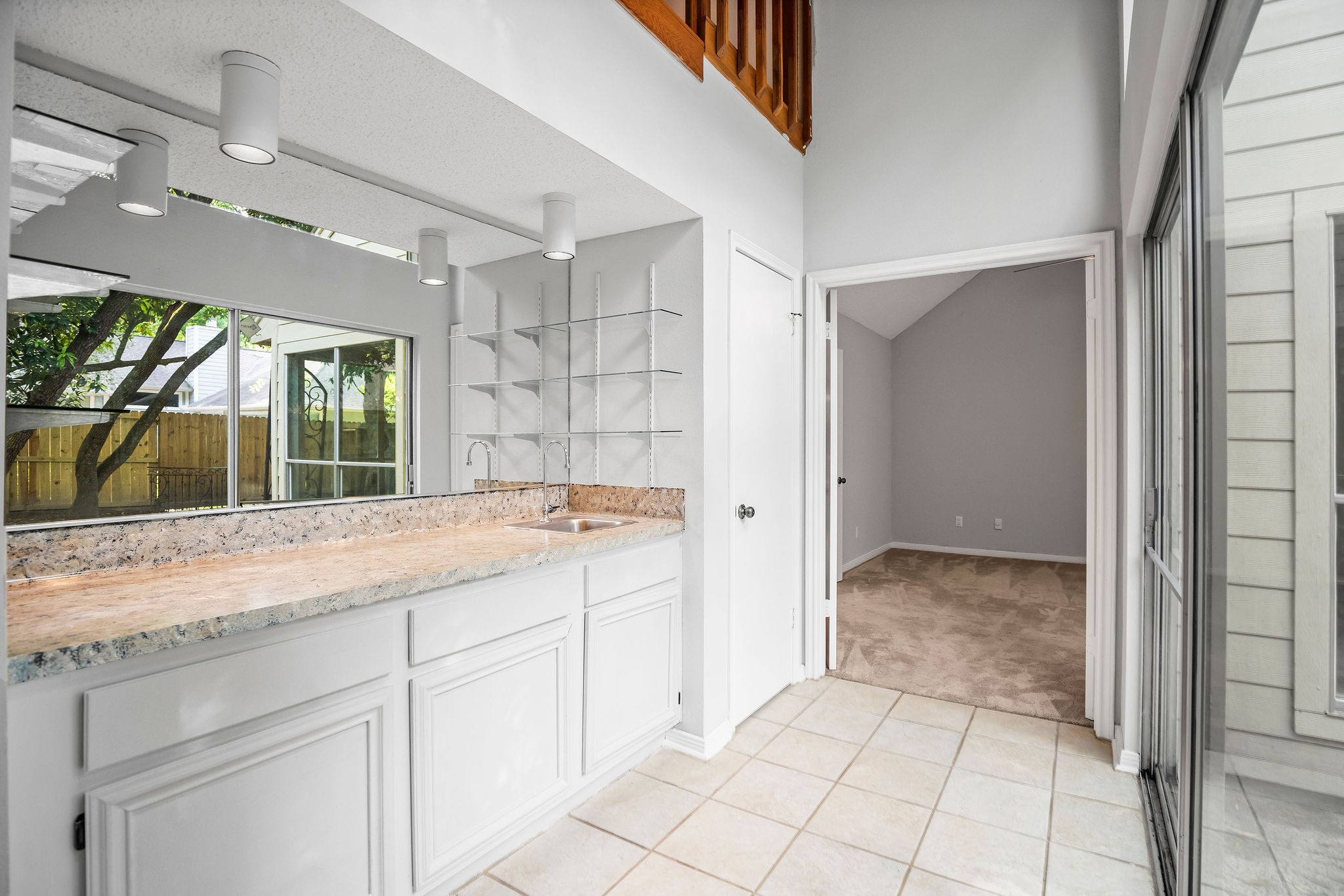 22 South Rain Forest Court Spring, TX 77380 - Photo 13 of 29 a bathroom with a granite countertop sink and a mirror