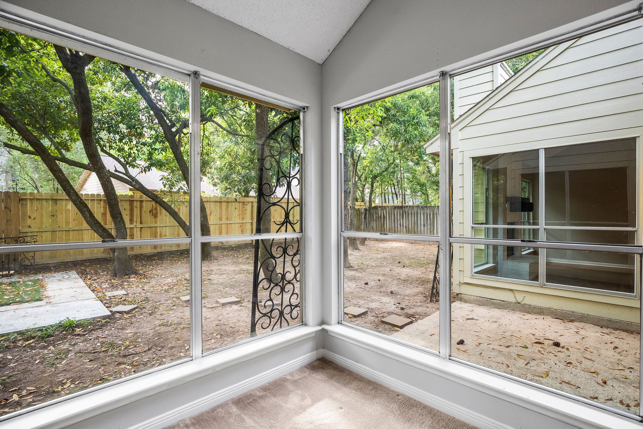 22 South Rain Forest Court Spring, TX 77380 - Photo 18 of 29 a view of a porch with a floor to ceiling window and wooden floor