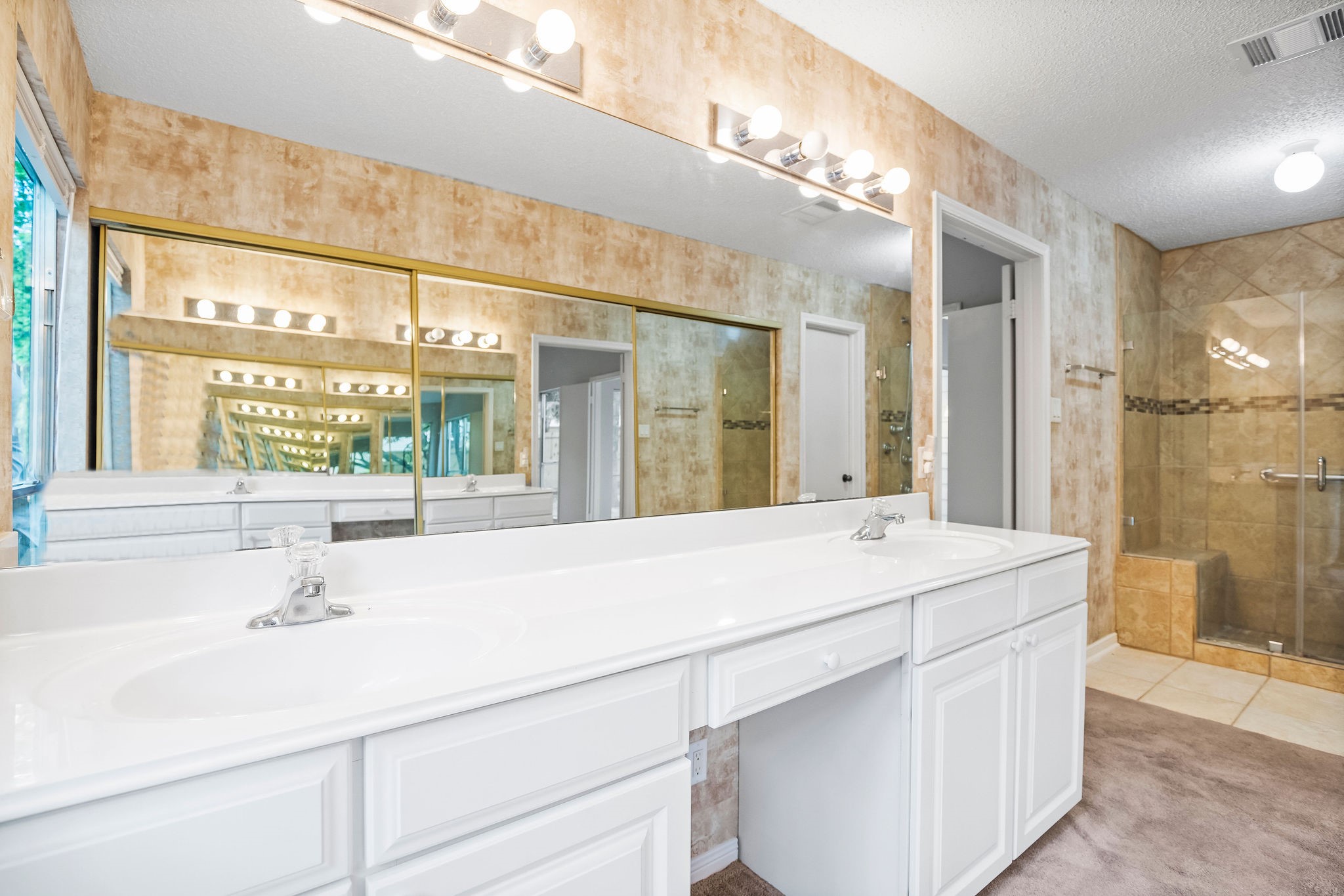 22 South Rain Forest Court Spring, TX 77380 - Photo 20 of 29 a bathroom with a sink and a mirror