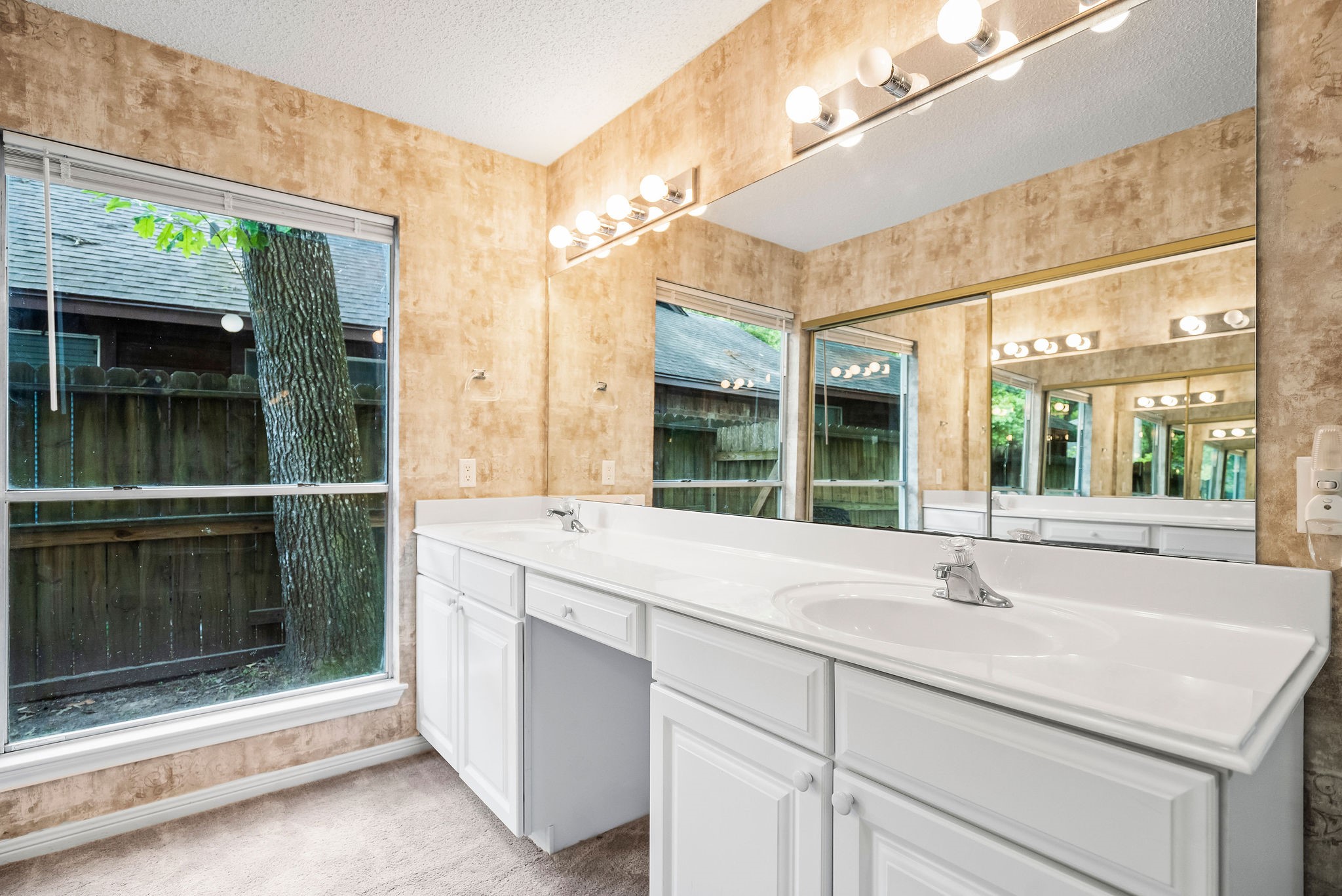 22 South Rain Forest Court Spring, TX 77380 - Photo 22 of 29 a bathroom with a sink and a large mirror