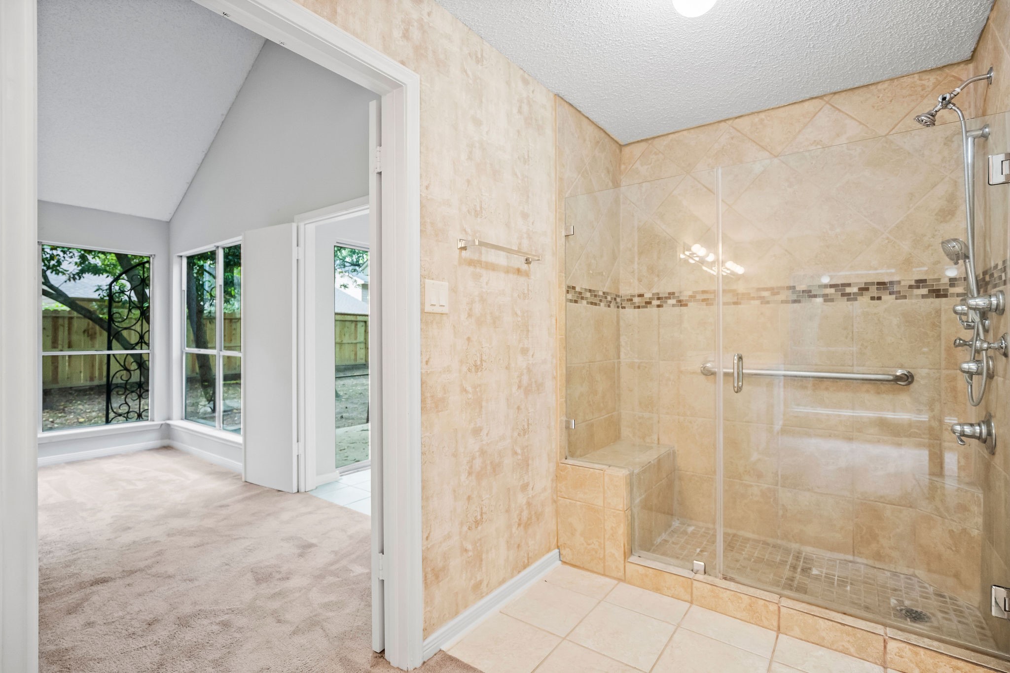22 South Rain Forest Court Spring, TX 77380 - Photo 23 of 29 a bathroom with a glass shower door