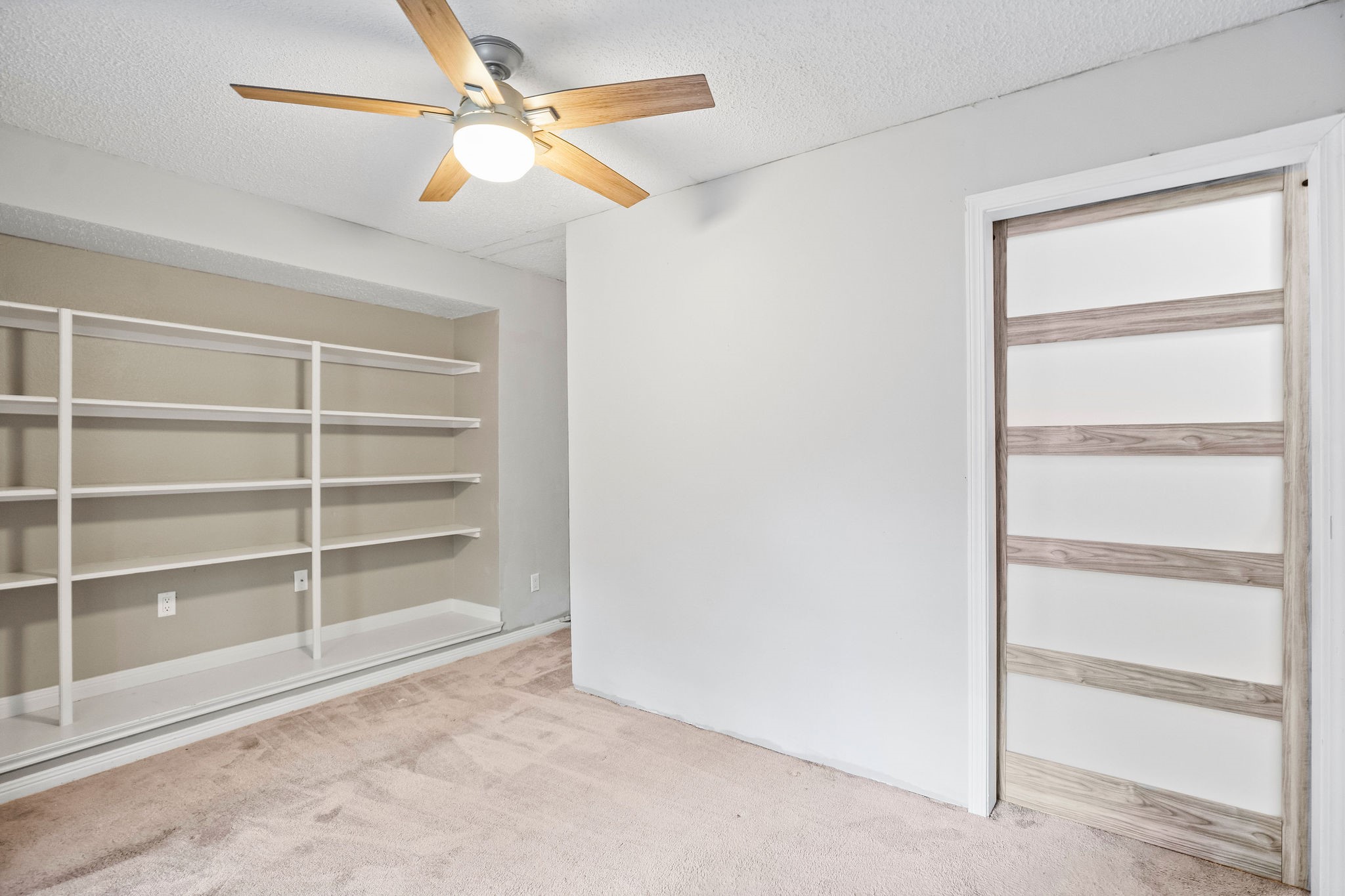 22 South Rain Forest Court Spring, TX 77380 - Photo 24 of 29 a view of an empty room with a window
