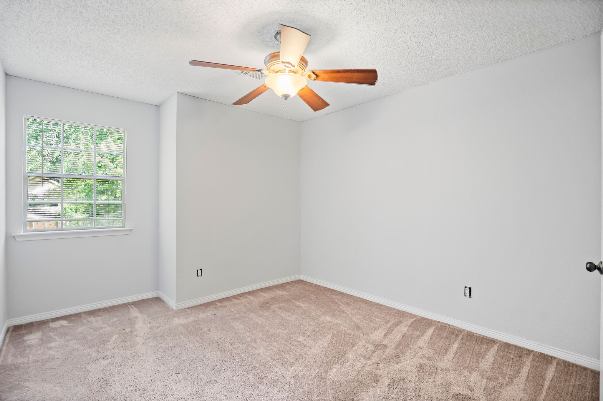 22 South Rain Forest Court Spring, TX 77380 - Photo 9 of 29 an empty room with a window