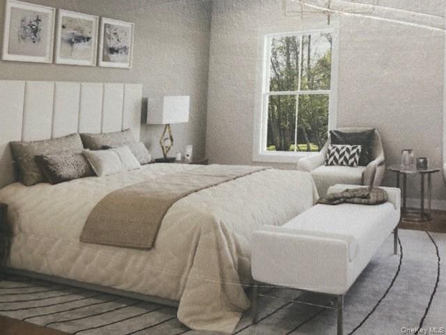 1767 Park Street Peekskill, NY 10566 - Photo 4 of 4 a bedroom with a bed and a large window