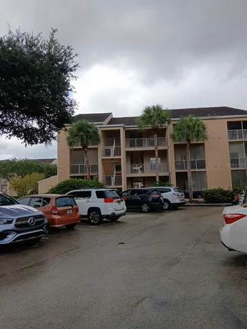 a view of house with outdoor space and swimming pool