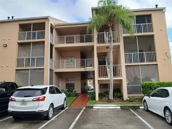 a view of house with outdoor space and lake view