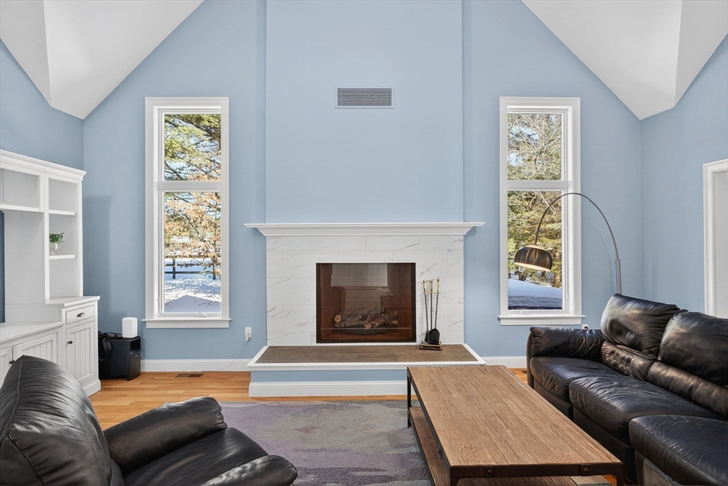 26 Crosswinds Way Falmouth, MA 02536 - Photo 12 of 41 a living room with furniture and a fireplace
