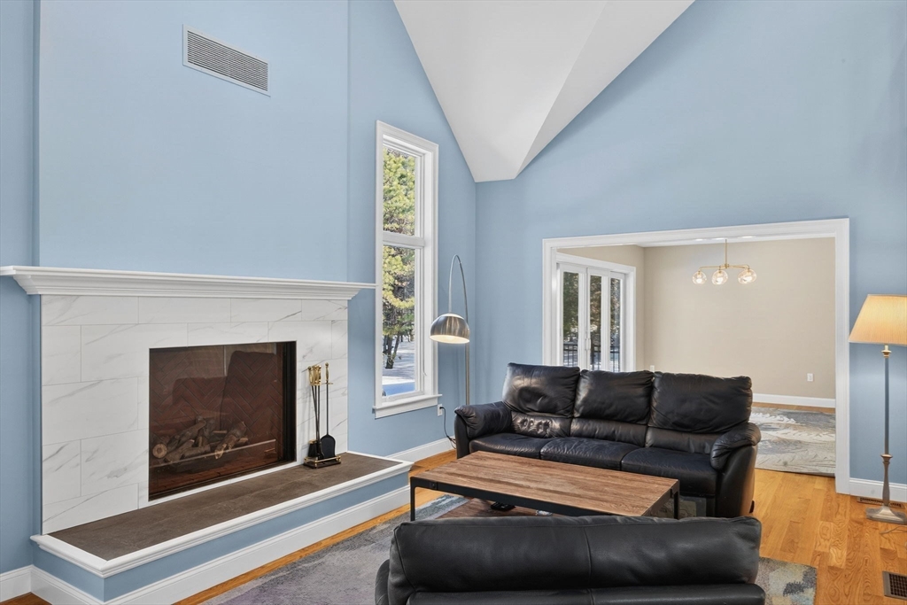 26 Crosswinds Way Falmouth, MA 02536 - Photo 13 of 41 a living room with furniture and a fireplace