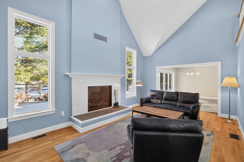 26 Crosswinds Way Falmouth, MA 02536 - Photo 14 of 41 a living room with furniture and a fireplace