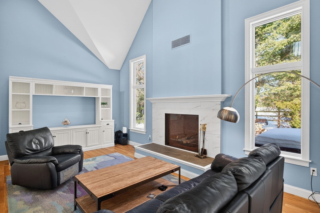 26 Crosswinds Way Falmouth, MA 02536 - Photo 16 of 41 a living room with furniture and a fireplace