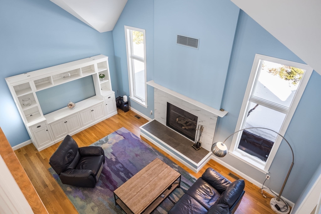 26 Crosswinds Way Falmouth, MA 02536 - Photo 18 of 41 a living room with furniture and a fireplace