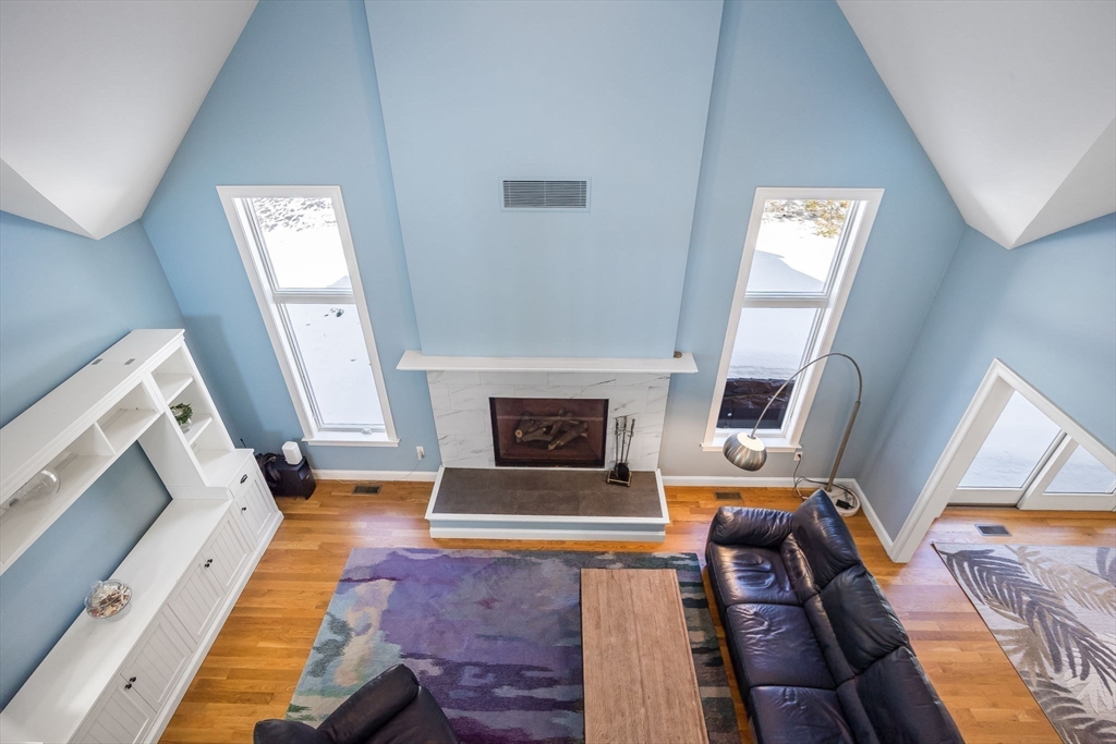 26 Crosswinds Way Falmouth, MA 02536 - Photo 19 of 41 a living room with furniture and a fireplace
