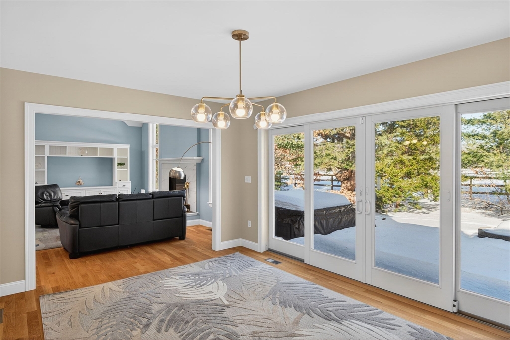 26 Crosswinds Way Falmouth, MA 02536 - Photo 21 of 41 a living room with furniture and a chandelier