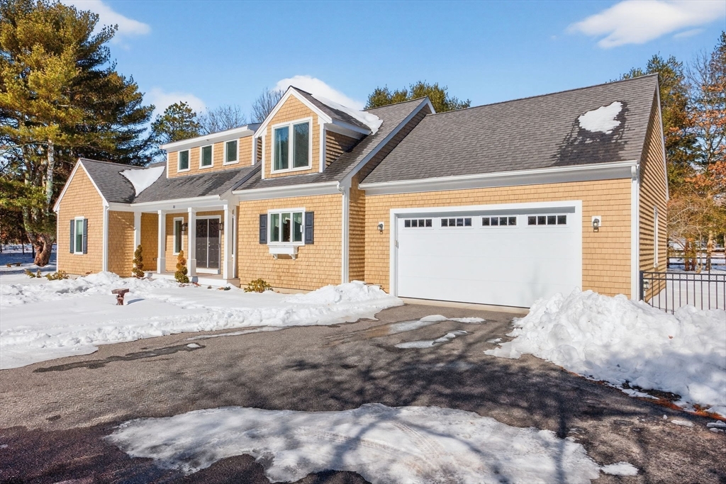 26 Crosswinds Way Falmouth, MA 02536 - Photo 3 of 41 a front view of a house with a yard