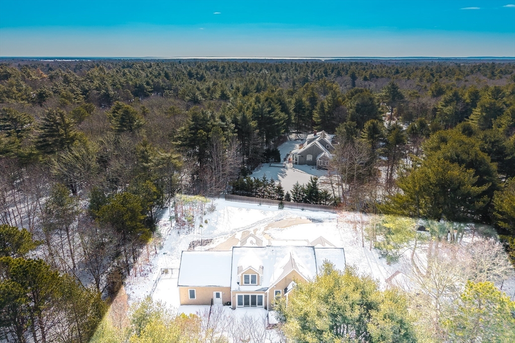 26 Crosswinds Way Falmouth, MA 02536 - Photo 7 of 41 a view of a wooden house with a yard