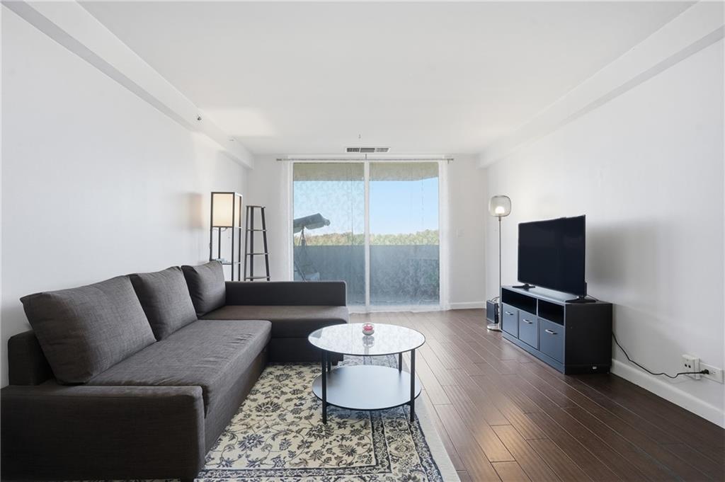 1501 Clairmont Road, Unit 1316 Decatur, GA 30033 - Photo 14 of 25 a living room with furniture and a flat screen tv