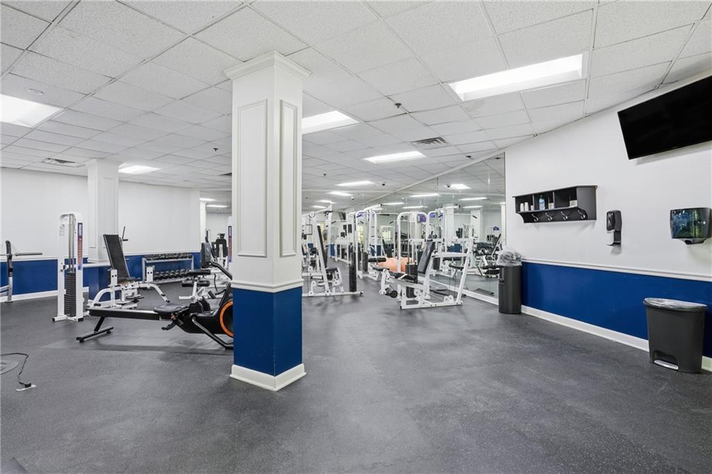 1501 Clairmont Road, Unit 1316 Decatur, GA 30033 - Photo 18 of 25 a living room with furniture and a flat screen tv