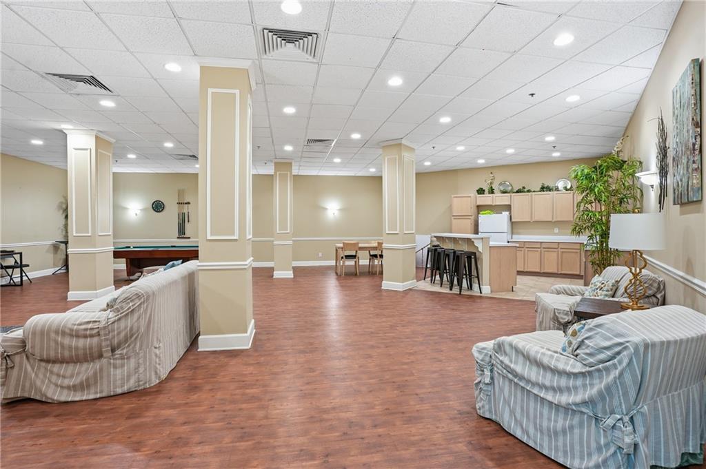 1501 Clairmont Road, Unit 1316 Decatur, GA 30033 - Photo 21 of 25 a living room with furniture kitchen view and a table