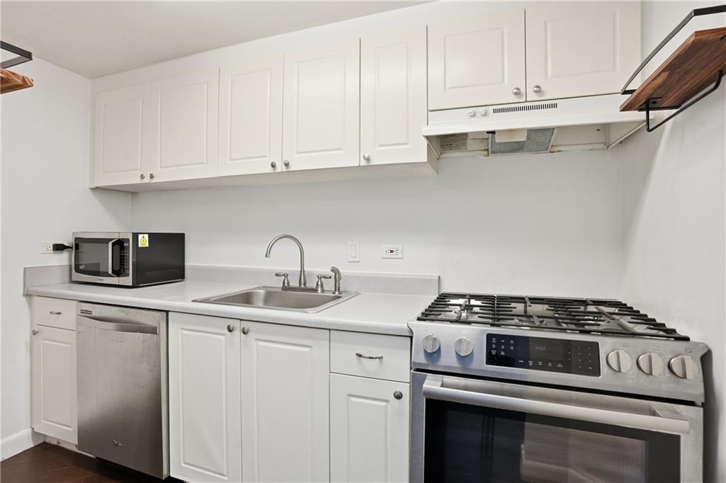 1501 Clairmont Road, Unit 1316 Decatur, GA 30033 - Photo 3 of 25 a kitchen with appliances a sink and cabinets