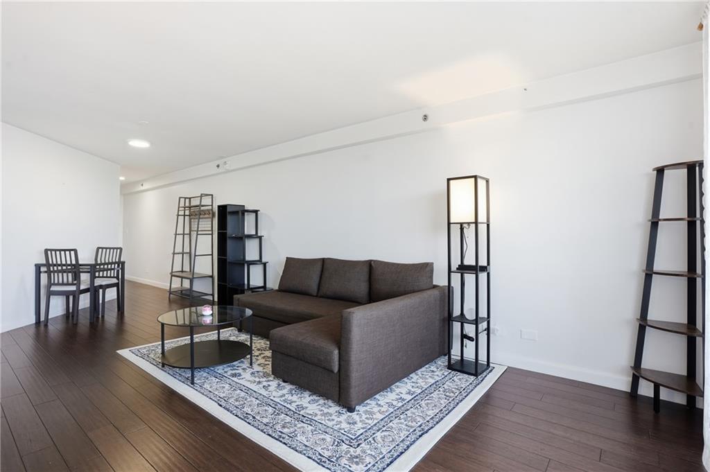 1501 Clairmont Road, Unit 1316 Decatur, GA 30033 - Photo 6 of 25 a living room with furniture and a wooden floor