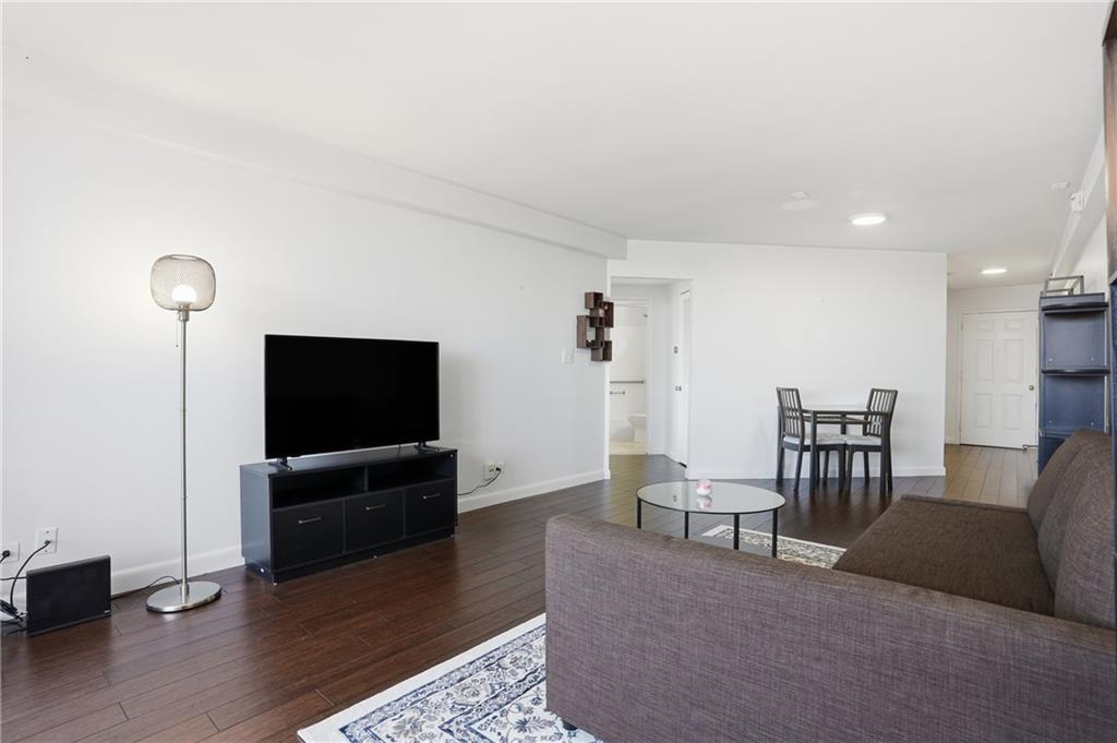 1501 Clairmont Road, Unit 1316 Decatur, GA 30033 - Photo 7 of 25 a living room with furniture and a flat screen tv