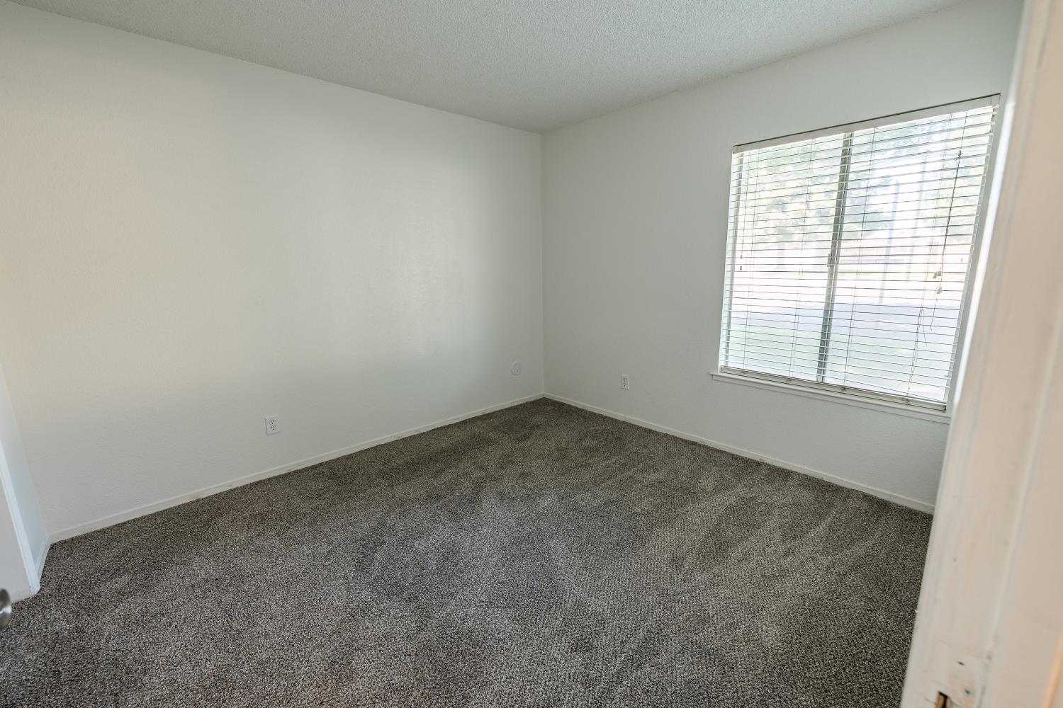 3700 Tully Road, Unit 5 Modesto, CA 95356 - Photo 14 of 38 an empty room with a window
