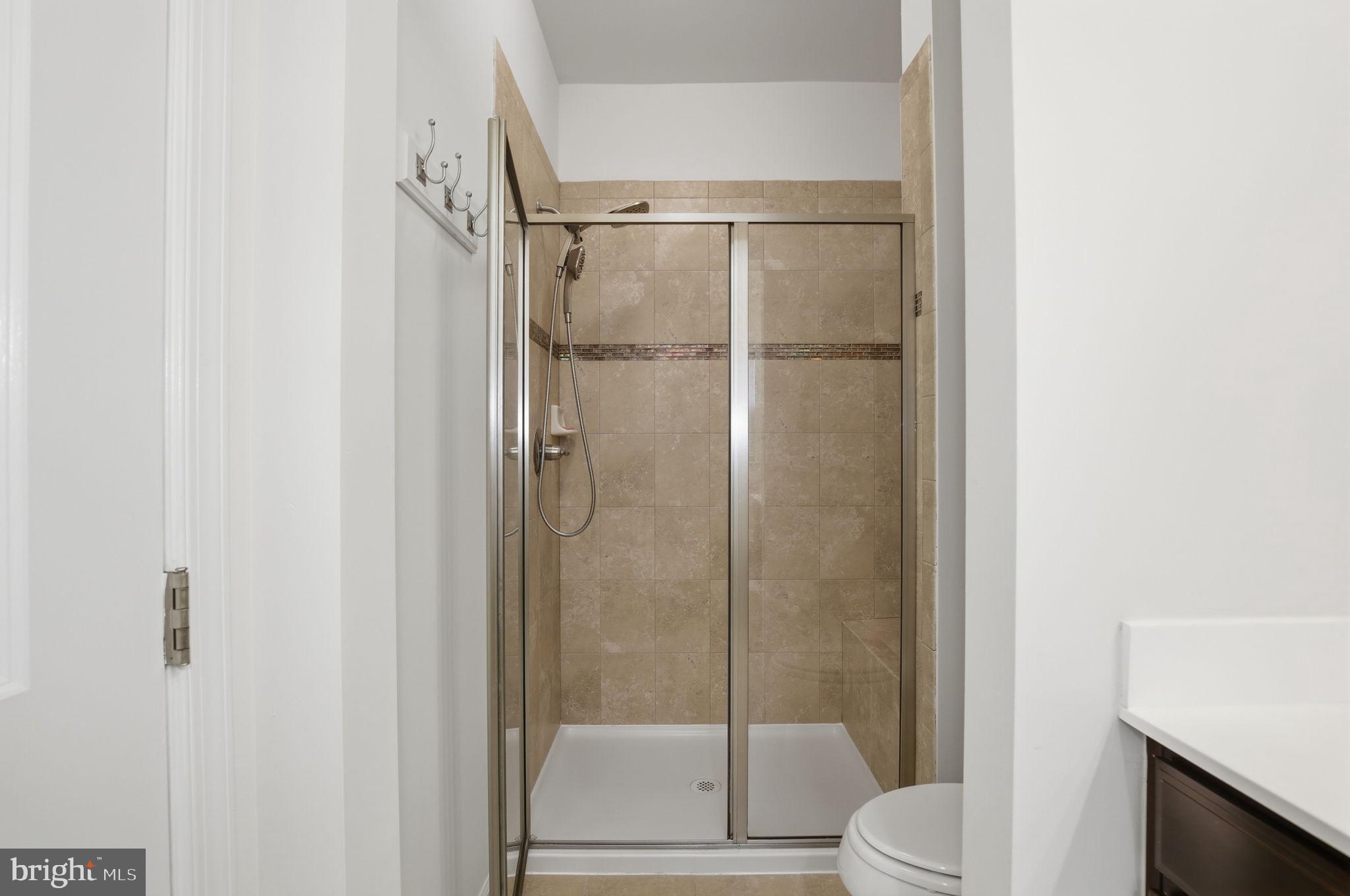 2784 Fredericksburg Road Hanover, MD 21076 - Photo 38 of 60 a bathroom with a shower and a toilet