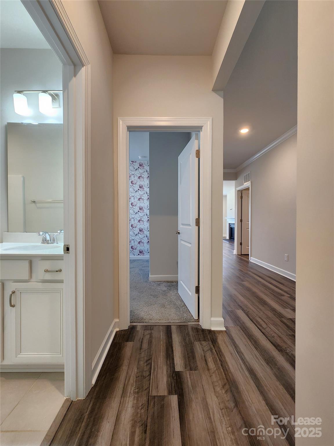 4227 Canopy Creek Drive Denver, NC 28037 - Photo 15 of 33 a view of a hallway with wooden floor and a bathroom