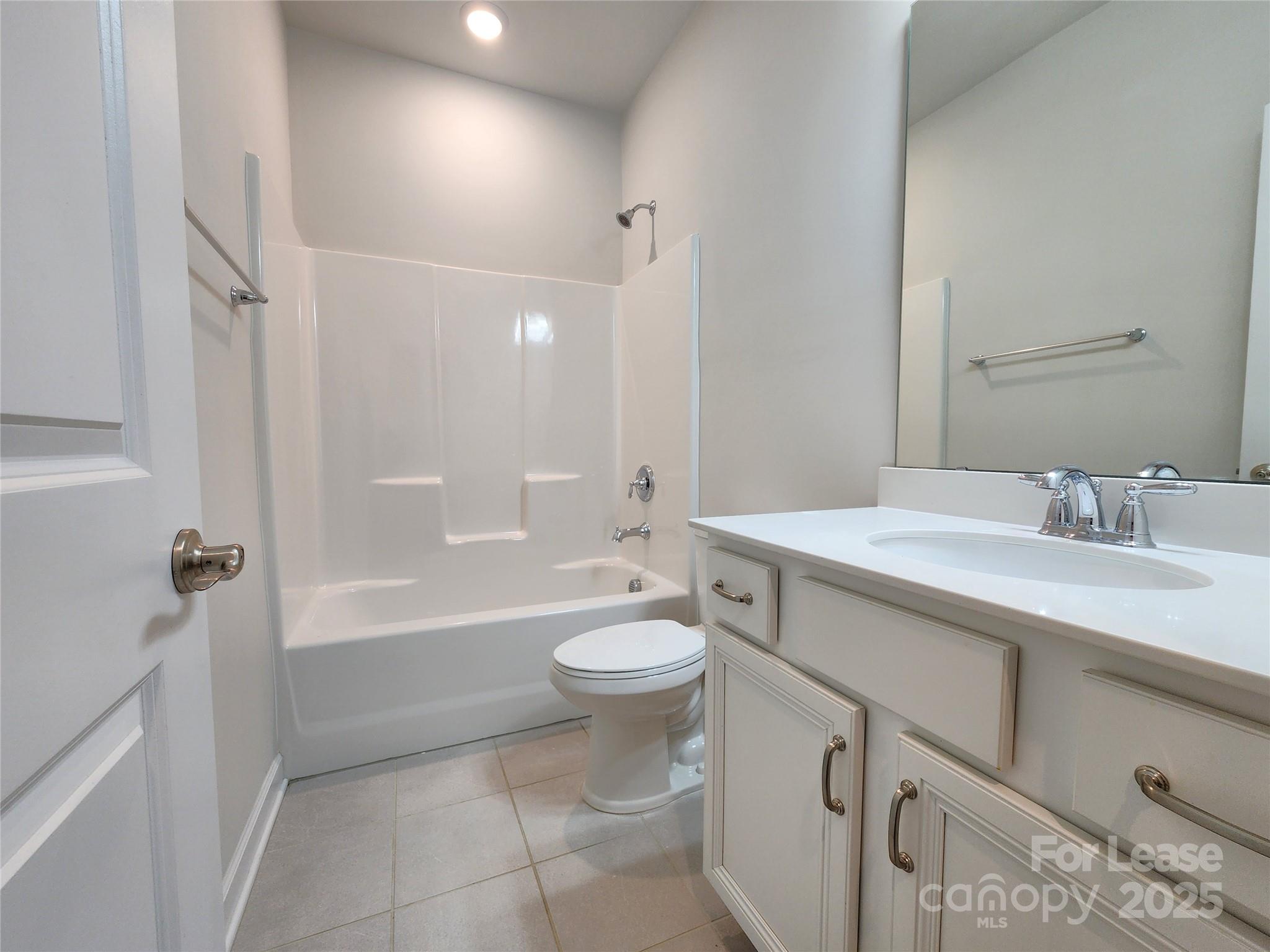 4227 Canopy Creek Drive Denver, NC 28037 - Photo 16 of 33 a bathroom with a double vanity sink toilet mirror and bathtub