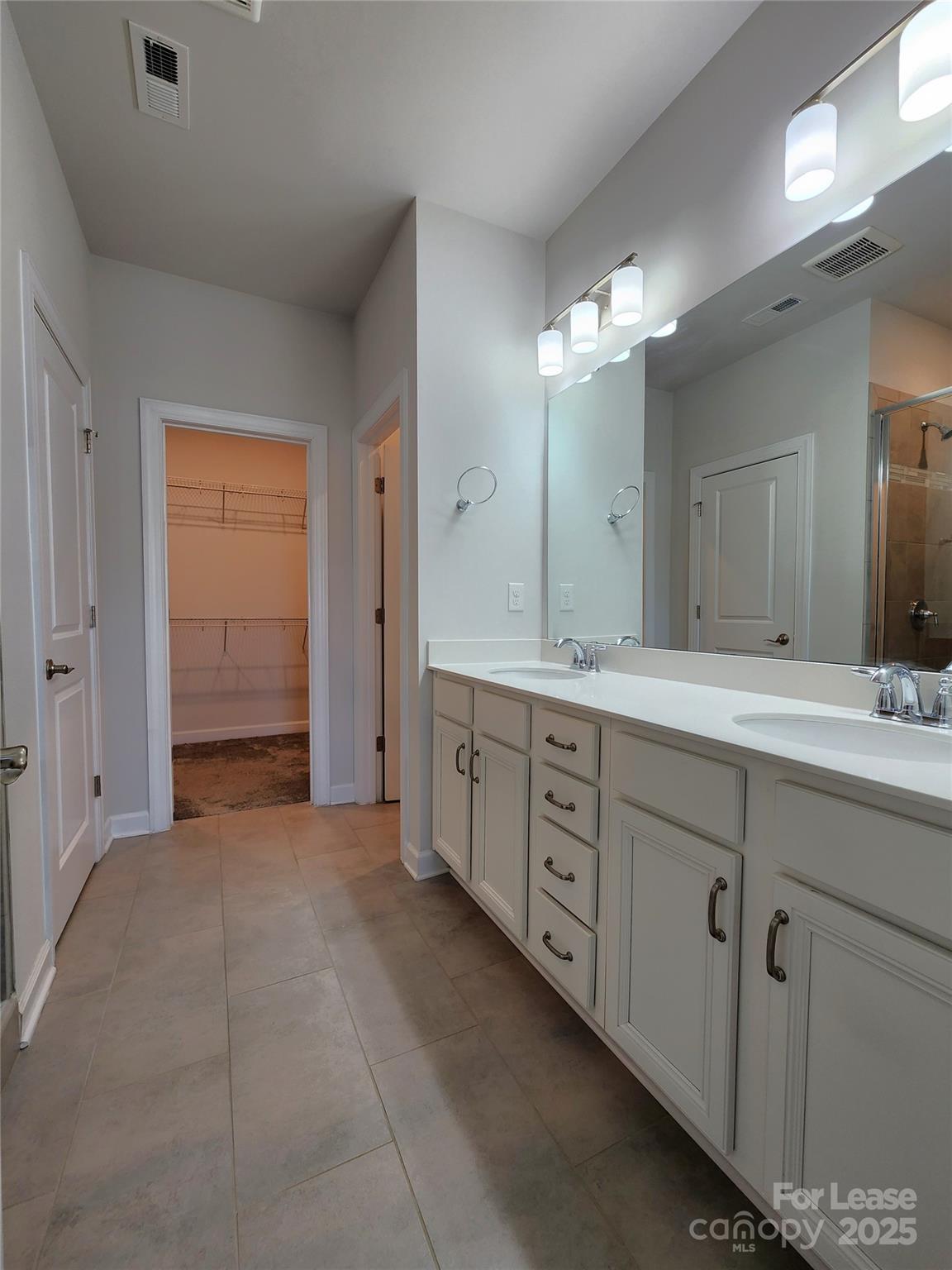 4227 Canopy Creek Drive Denver, NC 28037 - Photo 21 of 33 a spacious bathroom with a double vanity sink shower and a mirror