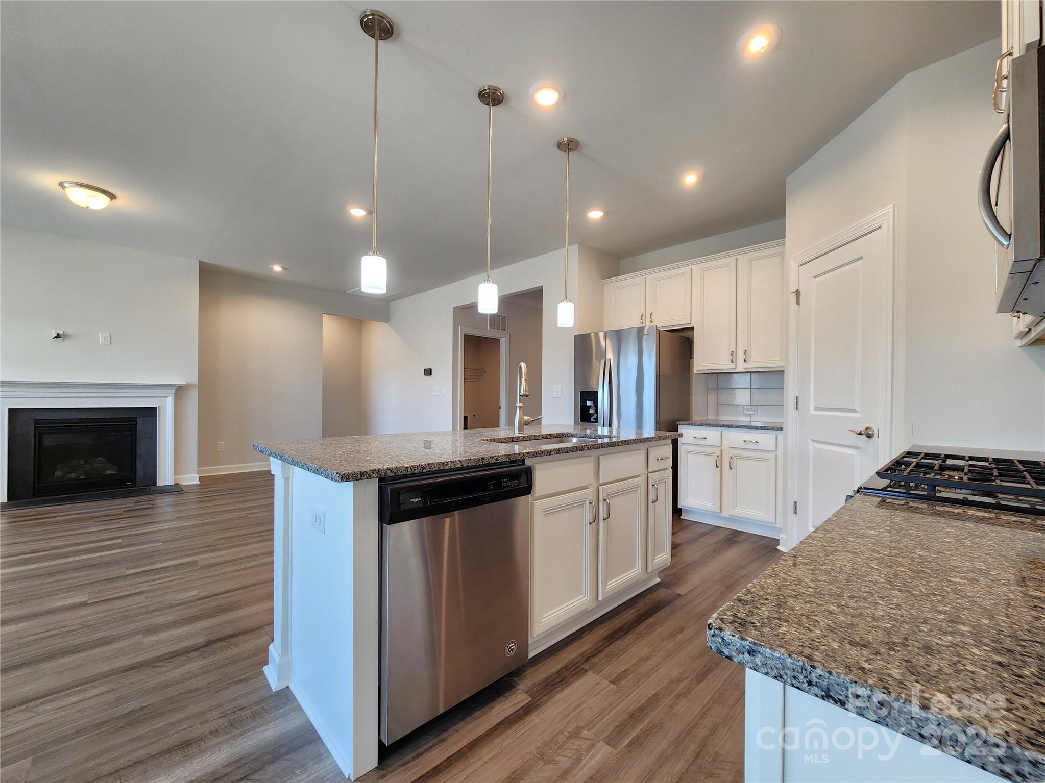 4227 Canopy Creek Drive Denver, NC 28037 - Photo 9 of 33 a large kitchen with granite countertop a stove and a sink
