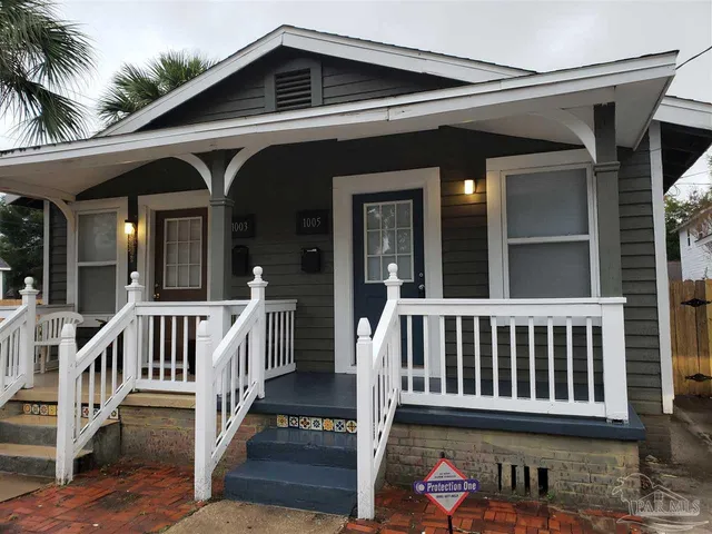 a view of a chair and table in the balcony