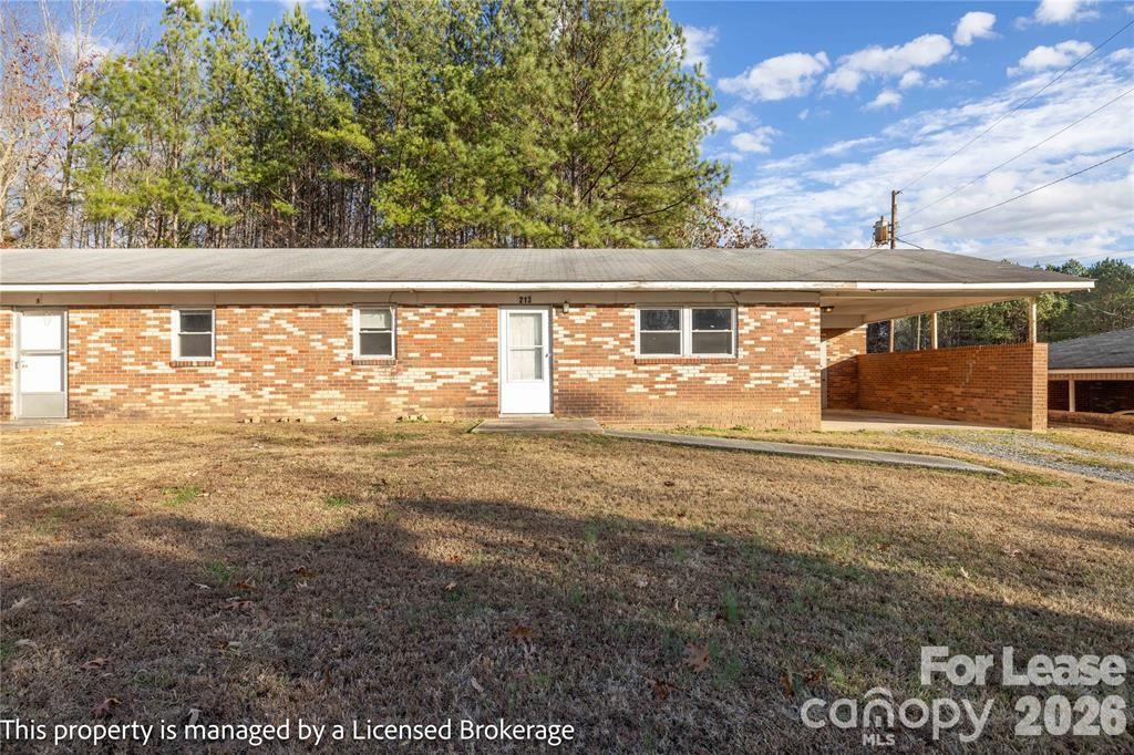 213 Roslyn Road Troy, NC 27371 - Photo 2 of 25 a view of back yard of the house
