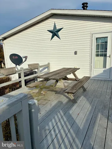 a front view of a house with barbeque oven