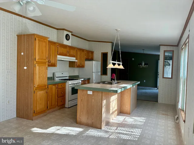 a kitchen with a stove and a refrigerator