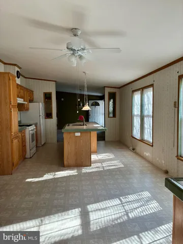 a view of a kitchen with a sink cabinets and window