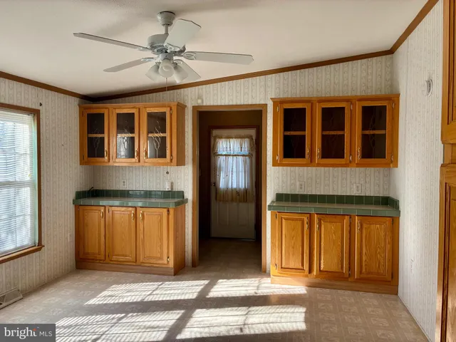 a view of a house with a barbeque and door