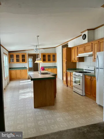 a kitchen with stainless steel appliances granite countertop a stove and a sink