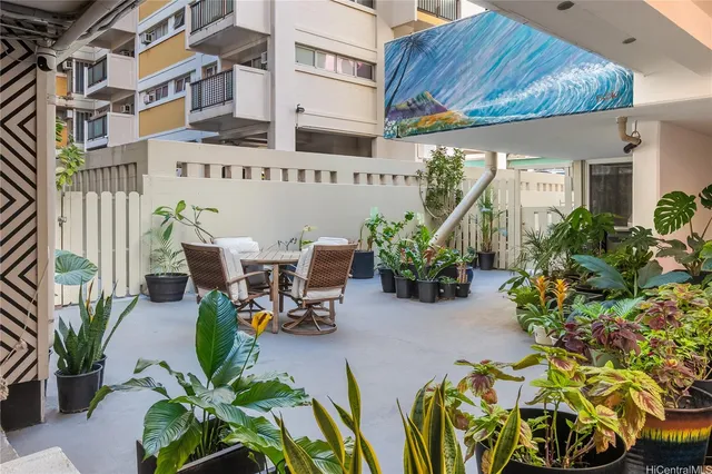 a view of a chairs and table in a patio