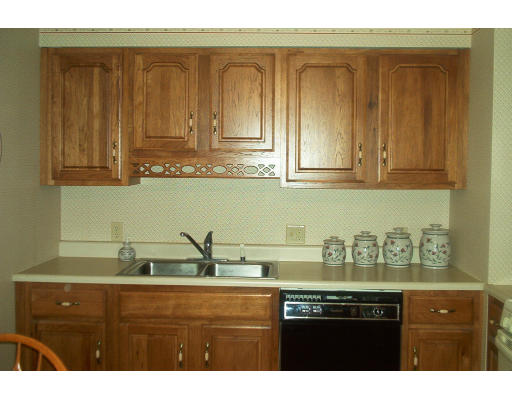 261 Whitney Road Ashby, MA 01431 - Photo 3 of 12 a view of cabinets with wooden floor