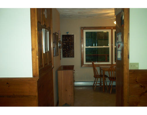 261 Whitney Road Ashby, MA 01431 - Photo 6 of 12 a balcony with table and chairs