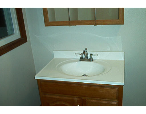 261 Whitney Road Ashby, MA 01431 - Photo 9 of 12 a bathroom with a sink and a vanity