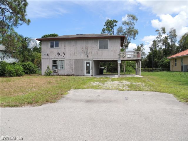 8175 Matanzas Road Fort Myers, FL 33967 - Photo 1 of 12 a front view of house with yard