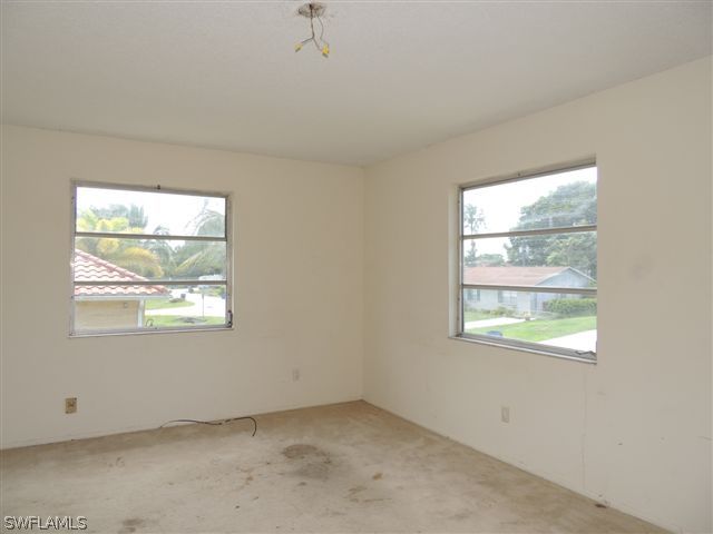 8175 Matanzas Road Fort Myers, FL 33967 - Photo 4 of 12 an empty room with a window