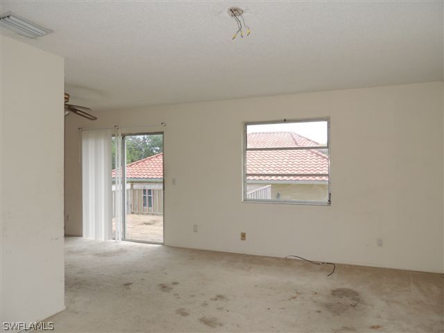 8175 Matanzas Road Fort Myers, FL 33967 - Photo 5 of 12 an empty room with windows